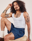 Jesse is wearing Denim Trouser Shorts in Dark Wash and Cropped Tank in vintage tee off-white