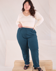 Ashley is 5'7" and wearing 0XL Easy Pants in Lagoon paired with vintage tee off-white Long Sleeve V-Neck Tee