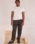 Issac is 5'10" and wearing M Easy Pants in Espresso Brown paired with Organic Vintage Tee in vintage tee off-white