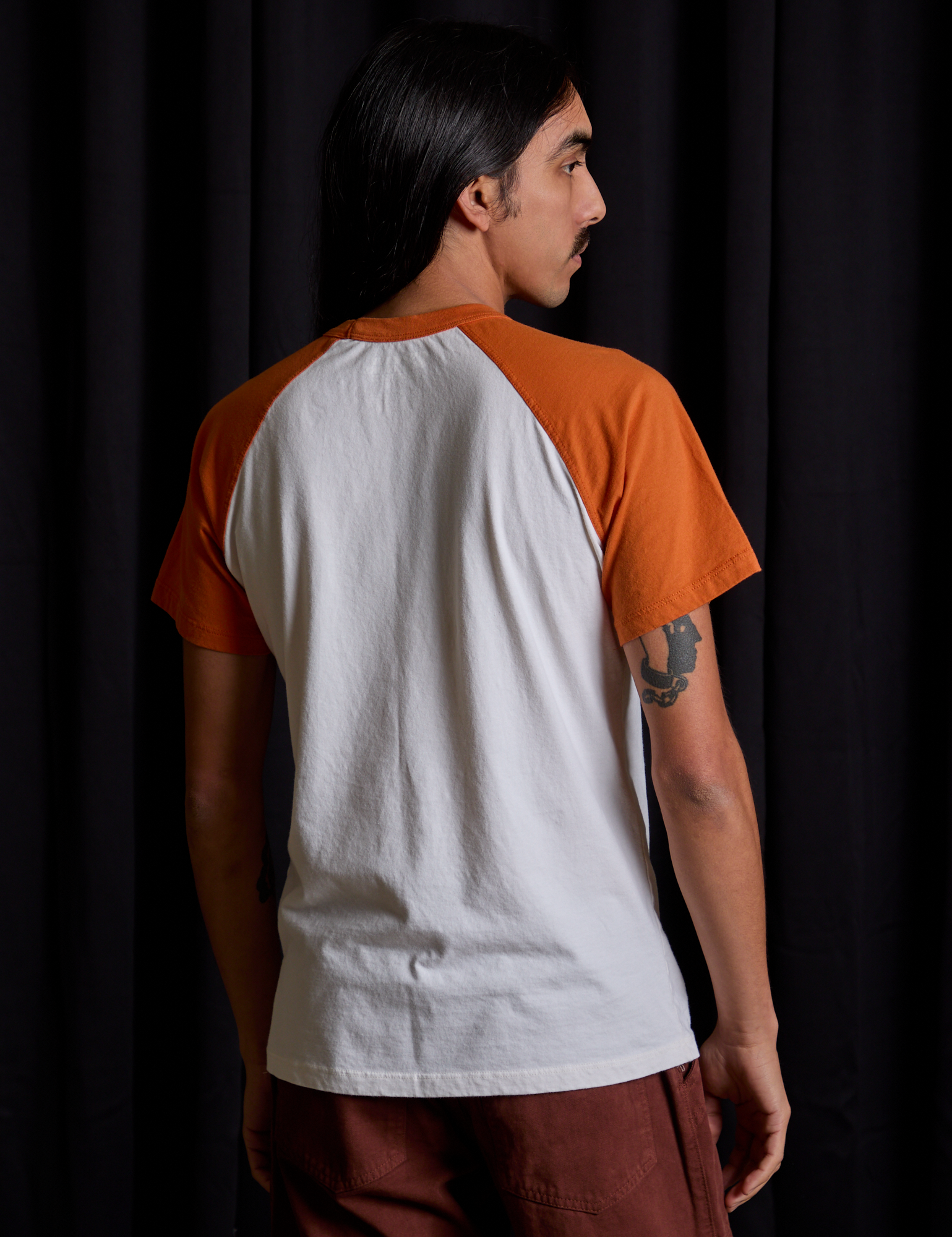 Short Sleeve Raglan Tee in Haunted House back view on Anthony