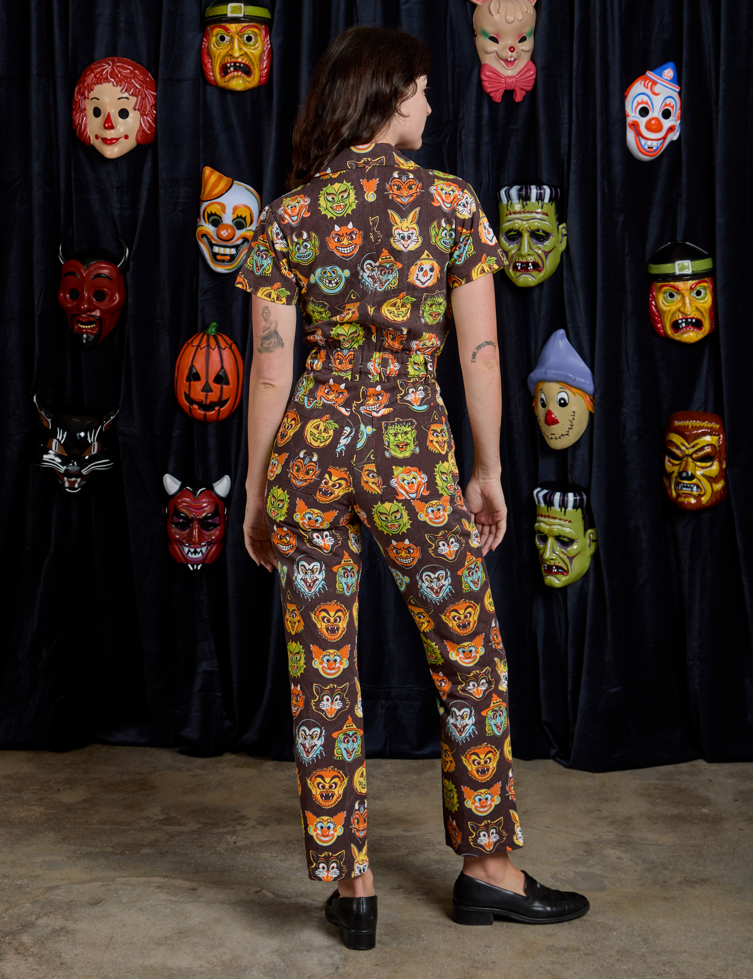 Short Sleeve Jumpsuit in Halloween Masks back view on Alex