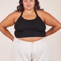 Alicia is 5'9" and wearing XL Halter Top in Basic Black paired with vintage off-white Western Pants