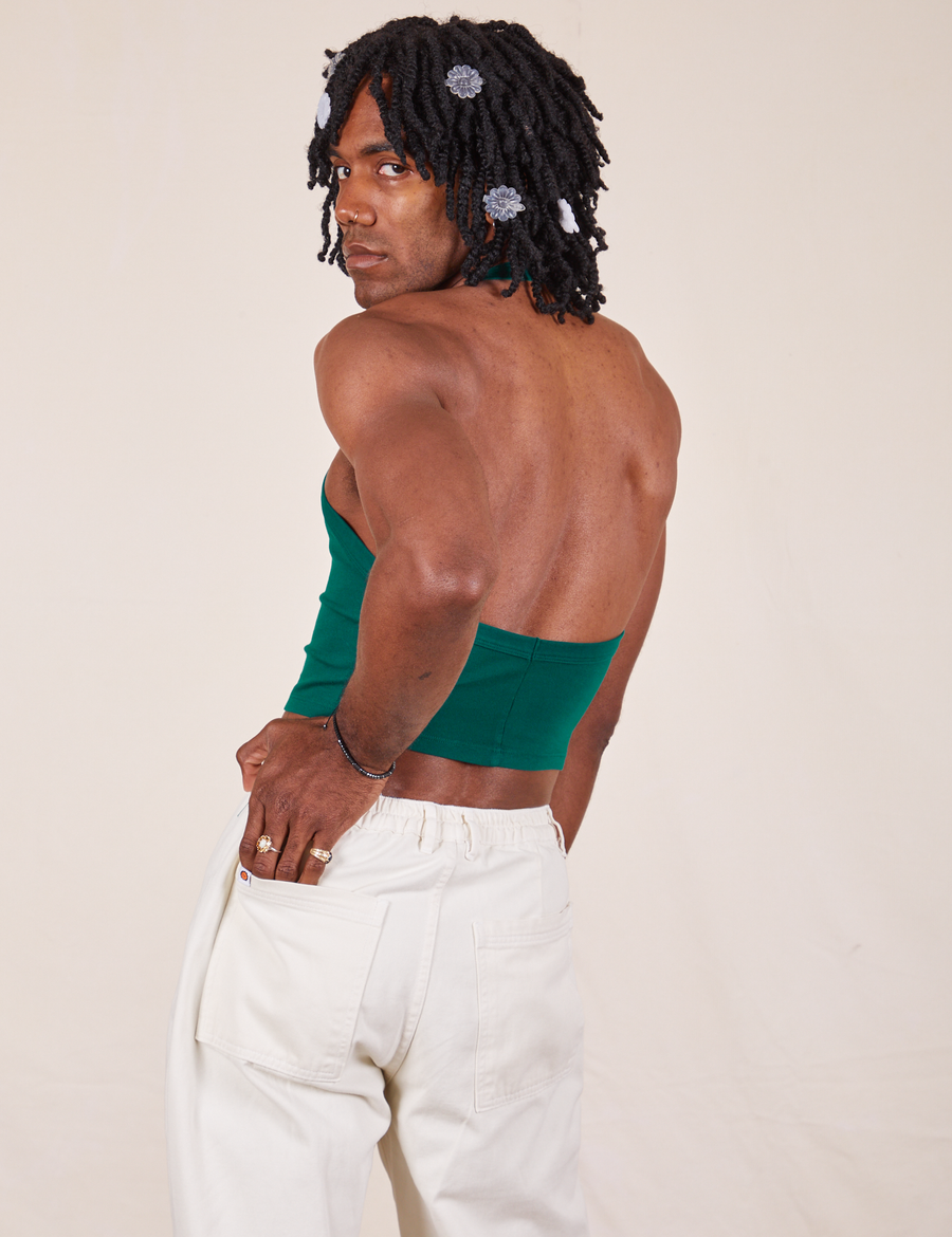 Back view of Halter Top in Hunter Green and vintage off-white Western Pants worn by Jerrod