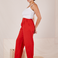 Side view of Heavyweight Trousers in Mustang Red and vintage off-white Cropped Cami worn by Tiara