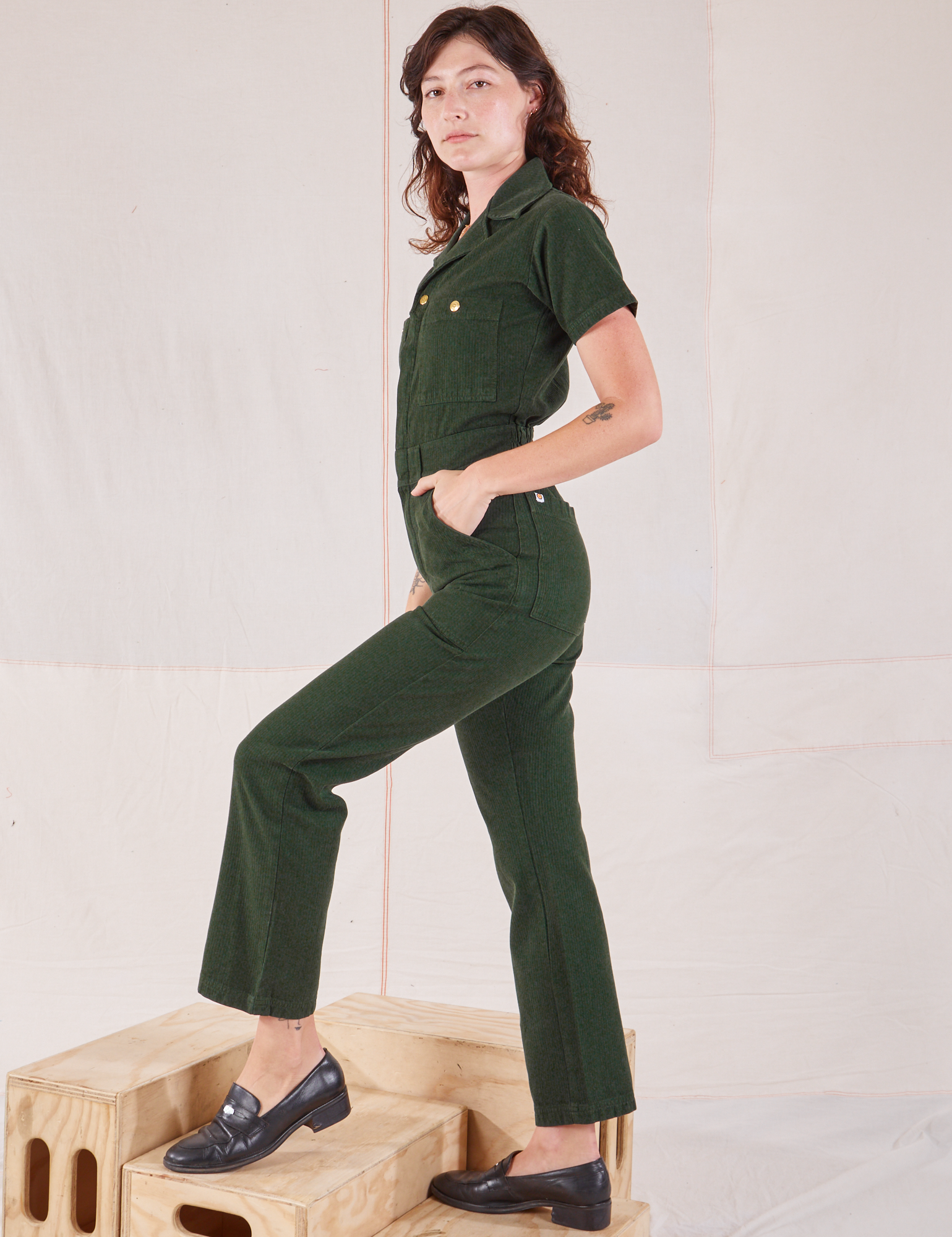 Heritage Short Sleeve Jumpsuit in Swamp Green side view on Alex