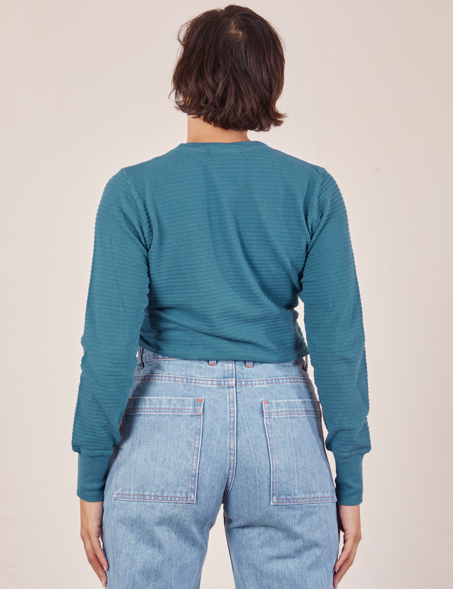 Back view of Honeycomb Thermal in Marine Blue worn by Tiara