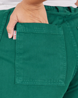 Back pocket close up of Bell Bottoms in Hunter Green worn by Tiara