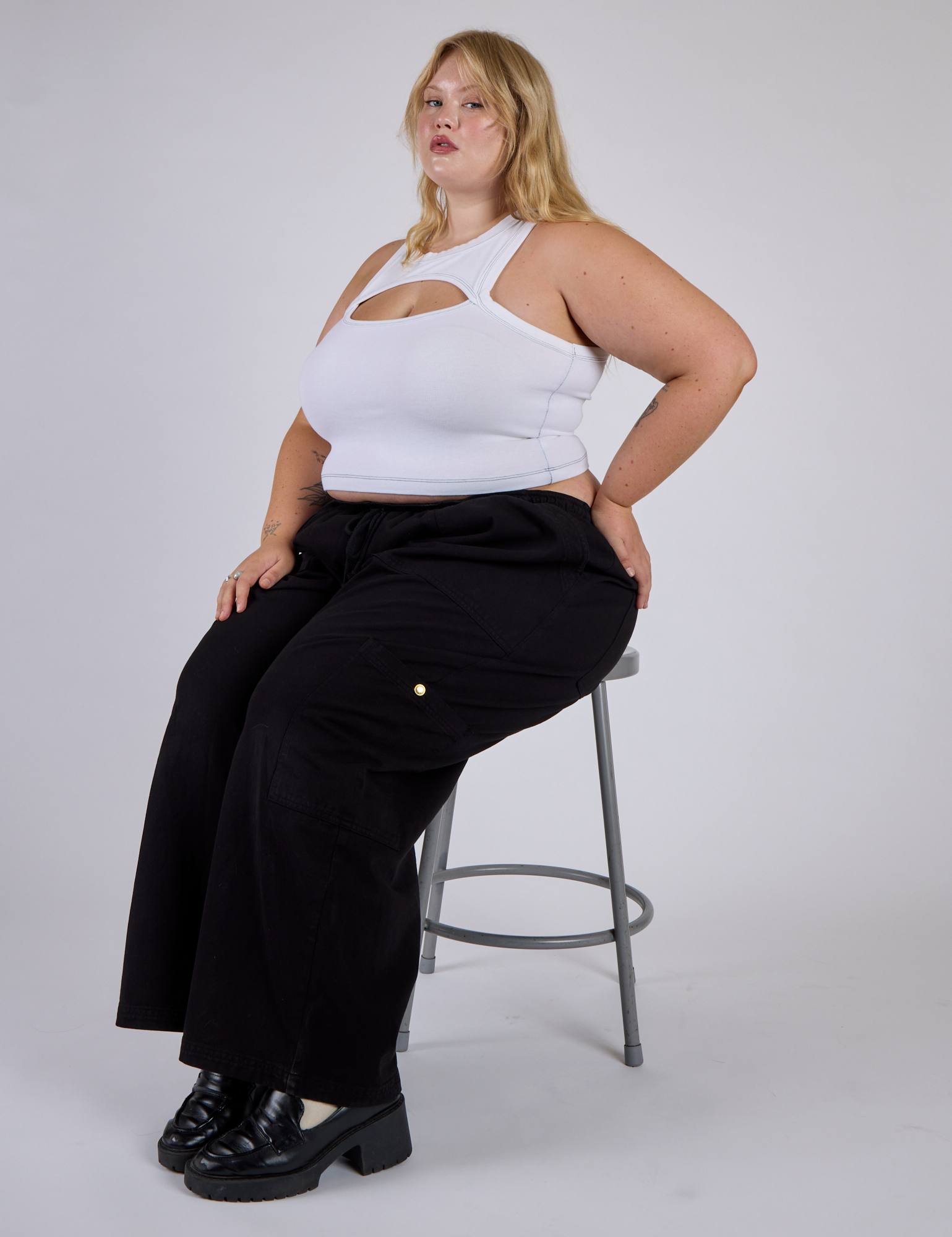 Juliet wearing the Vintage Tee White Porthole Tank with Black Drop Pocket Cargo Pants