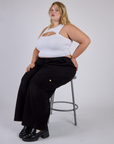 Juliet wearing the Vintage Tee White Porthole Tank with Black Drop Pocket Cargo Pants