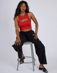 Kandia is wearing Porthole Tank in Mustang Red and Black Drop Pocket Cargo Pants