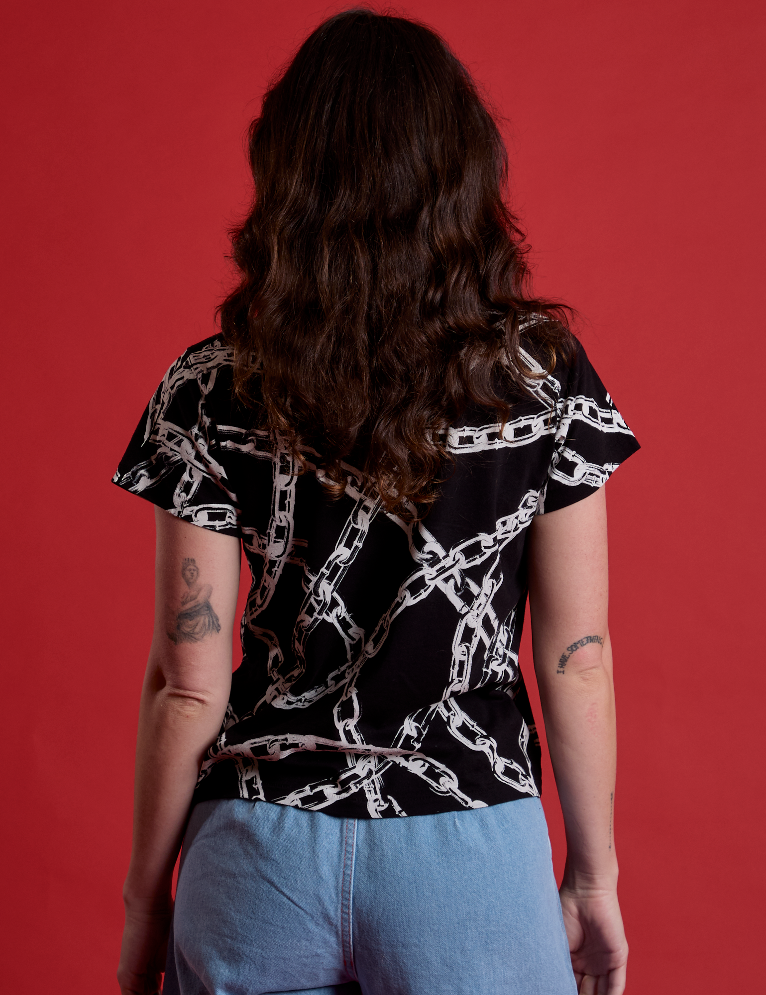 Back view of Chain Link Vintage Tee in Basic Black on Alex