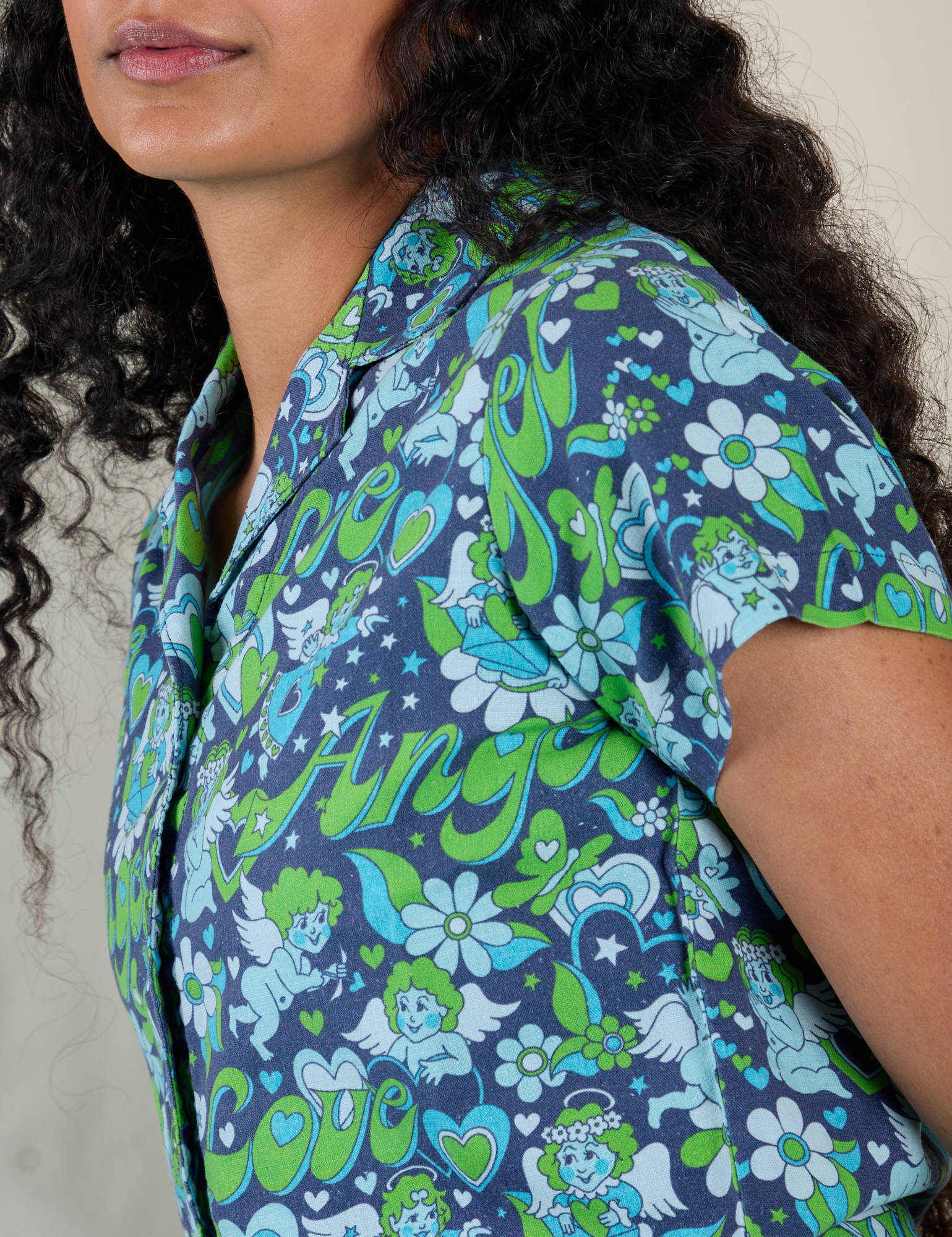 Close up side view of Angel Print Pantry Button-Up on Shahana