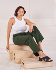 Tiara is wearing Organic Work Pants in Swamp Green and Racerback Tank in vintage tee off-white