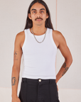 Anthony is 5’10” and wearing S Racerback Tank in Vintage Tee Off-White