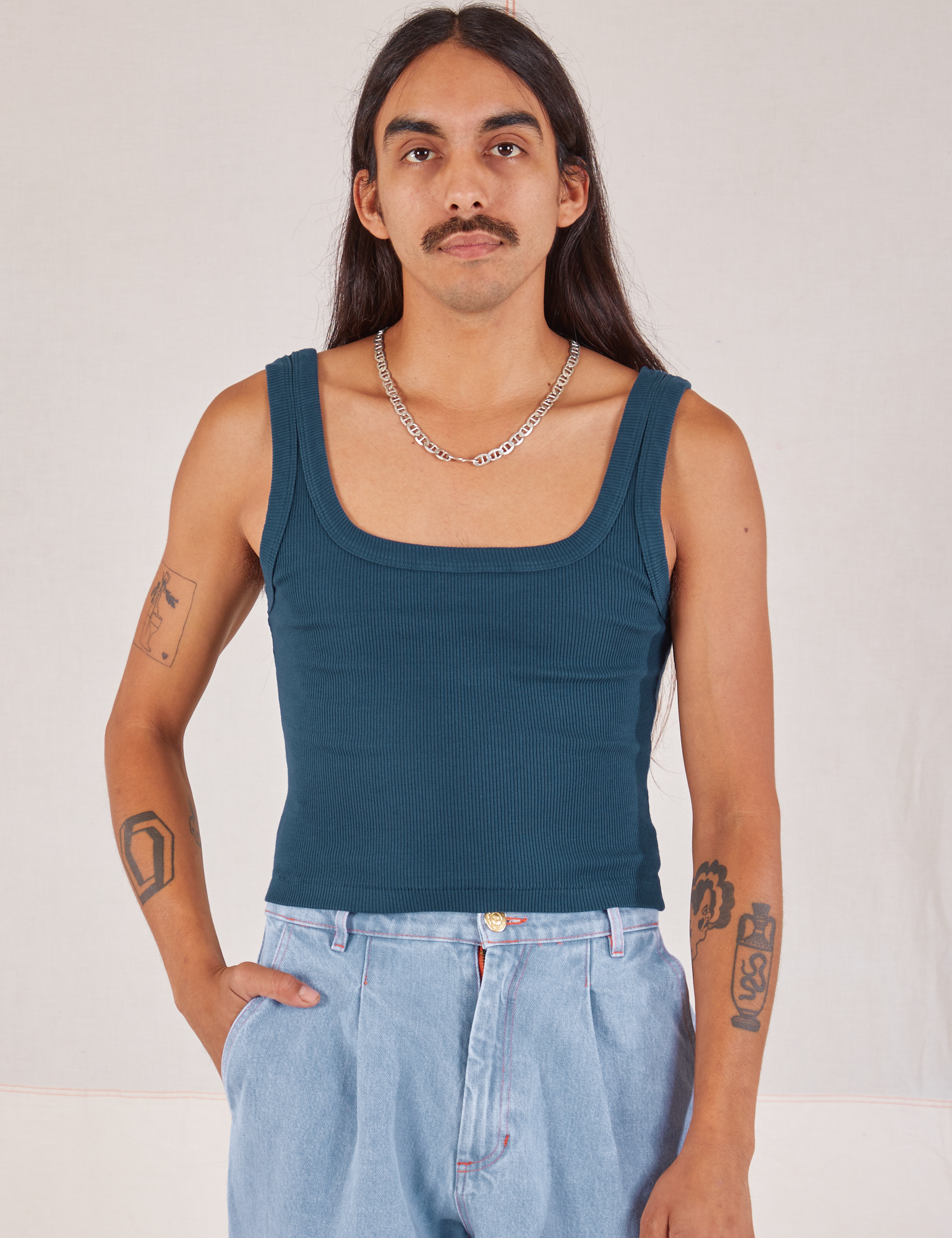 Anthony is 5’10” and wearing S Square Neck Tank in Lagoon