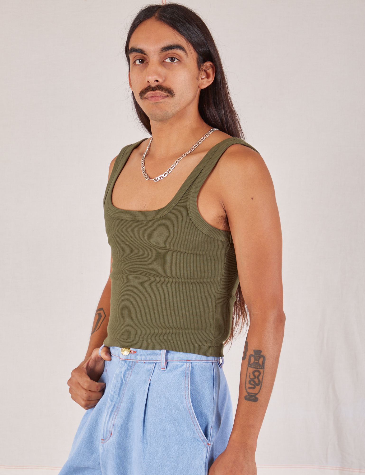 Square Neck Tank in Surplus Green angled front view on Anthony