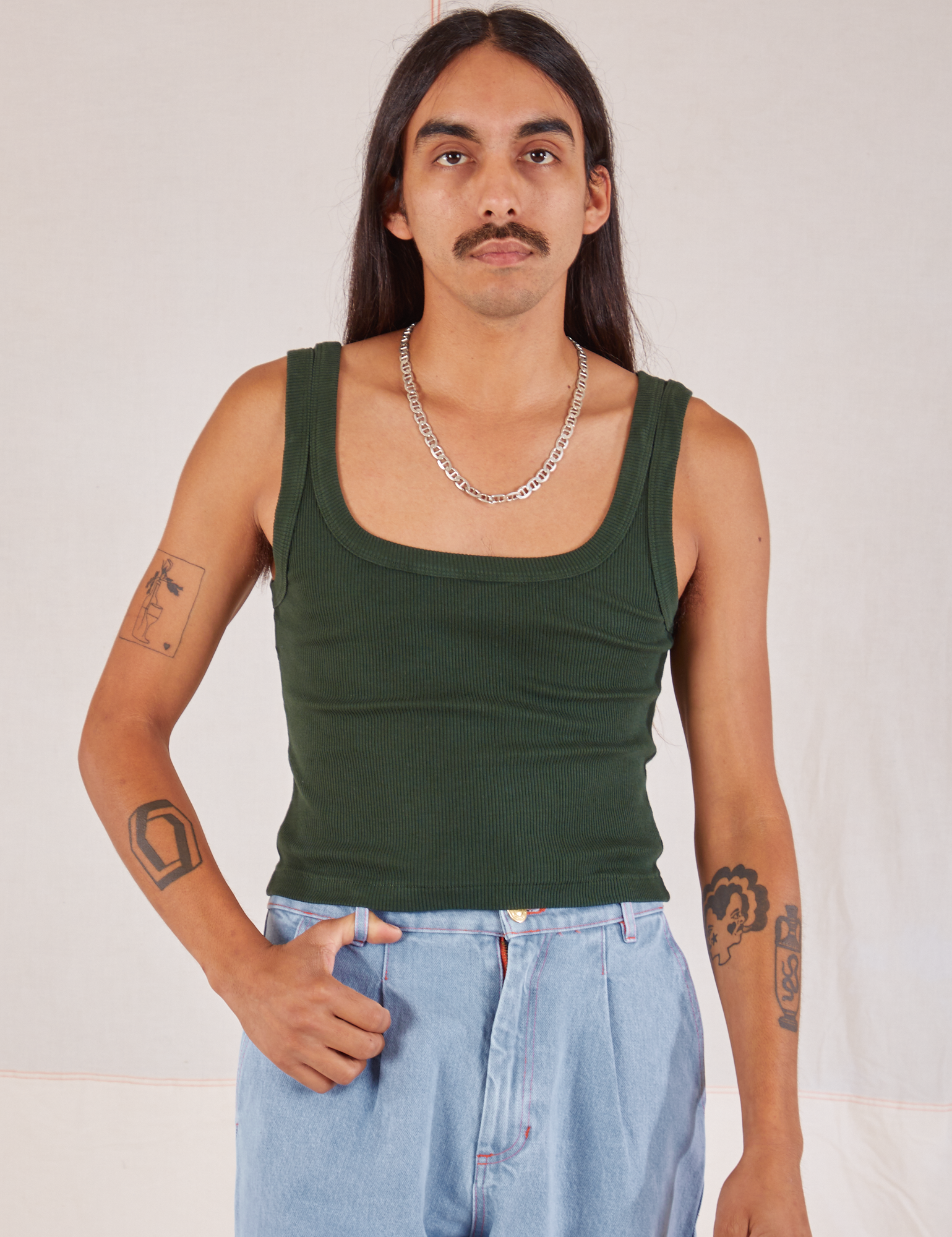 Anthony is 5’10” and wearing S Square Neck Tank in Swamp Green