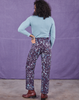 Back view of Marble Splatter Work Pants in Nebula Purple and baby blue Long Sleeve Fisherman Polo on Jesse