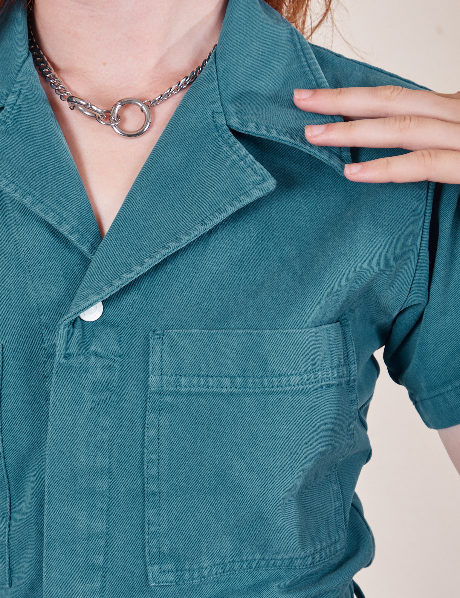 Front close up of Short Sleeve Jumpsuit in Marine Blue worn by Alex