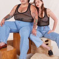 Sam and Allison are both wearing Mesh Tank Top in Basic Black and light wash Sailor Jeans