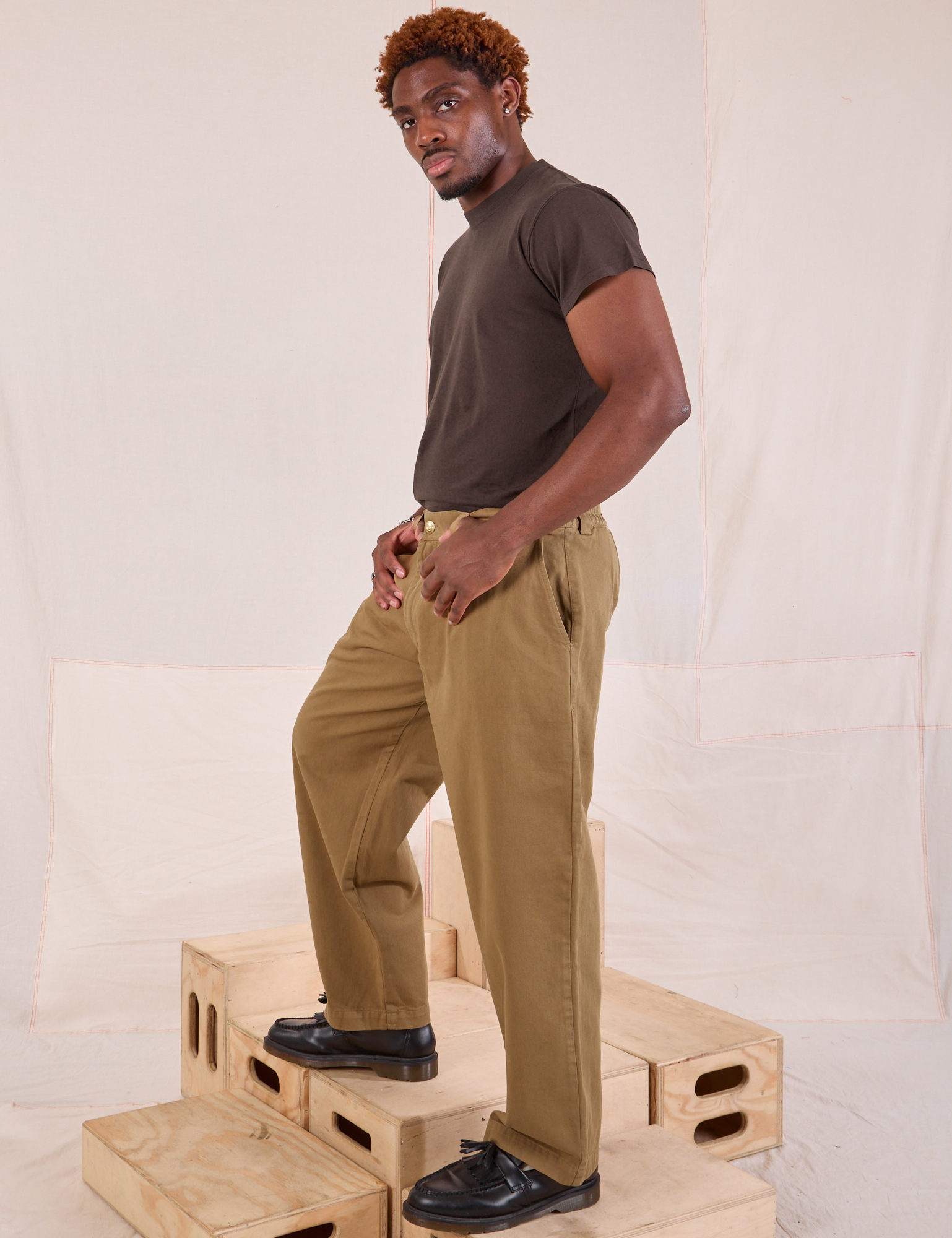 Side view of Mid-Rise Pleated Trousers in Desert Brown and espresso brown Organic Vintage Tee