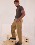 Side view of Mid-Rise Pleated Trousers in Desert Brown and espresso brown Organic Vintage Tee