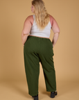 Baggy Mid-Rise Trousers in Evergreen back view on Juliet