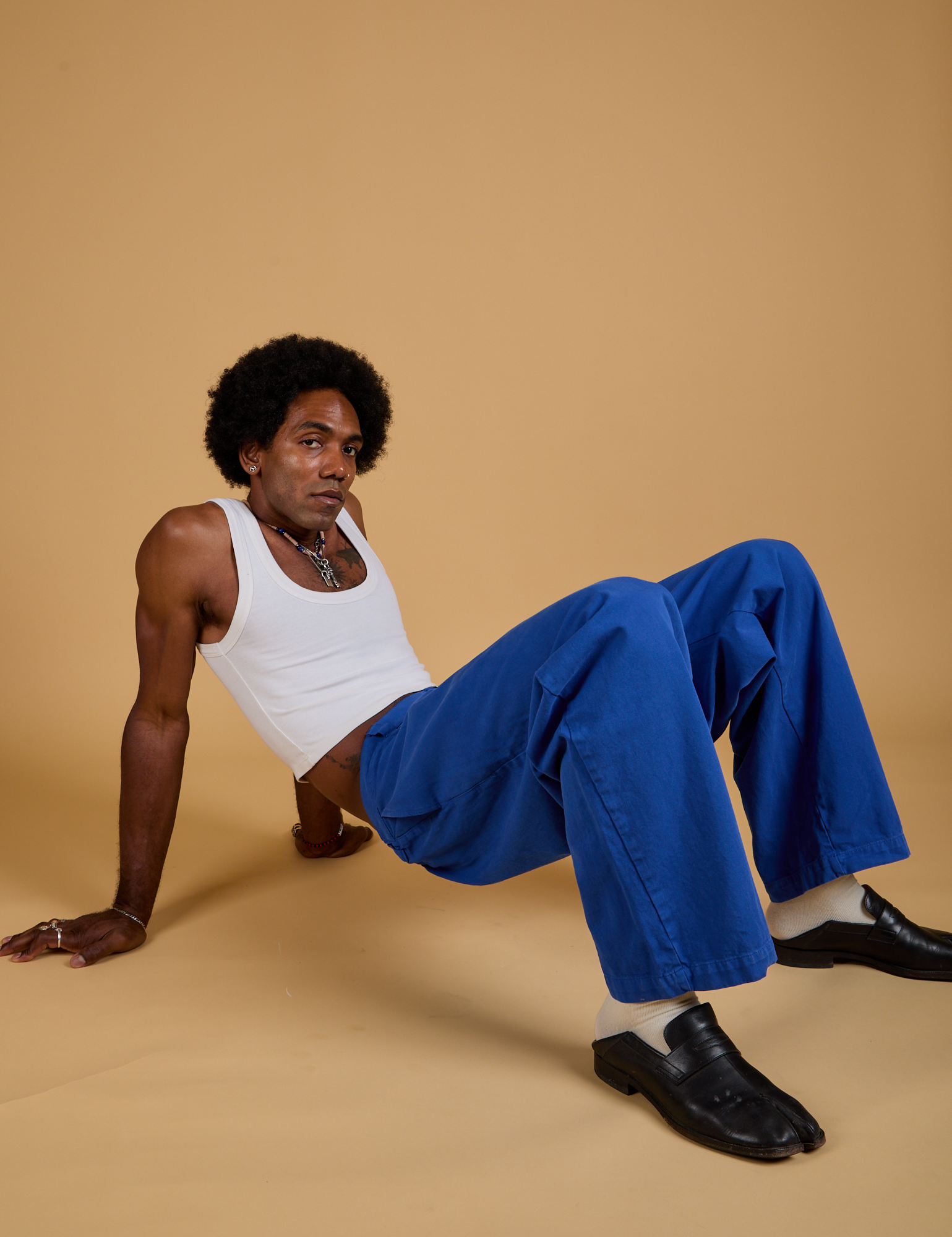 Baggy Mid-Rise Trousers in Royal Blue and vintage tee white Cropped Tank on Jerrod