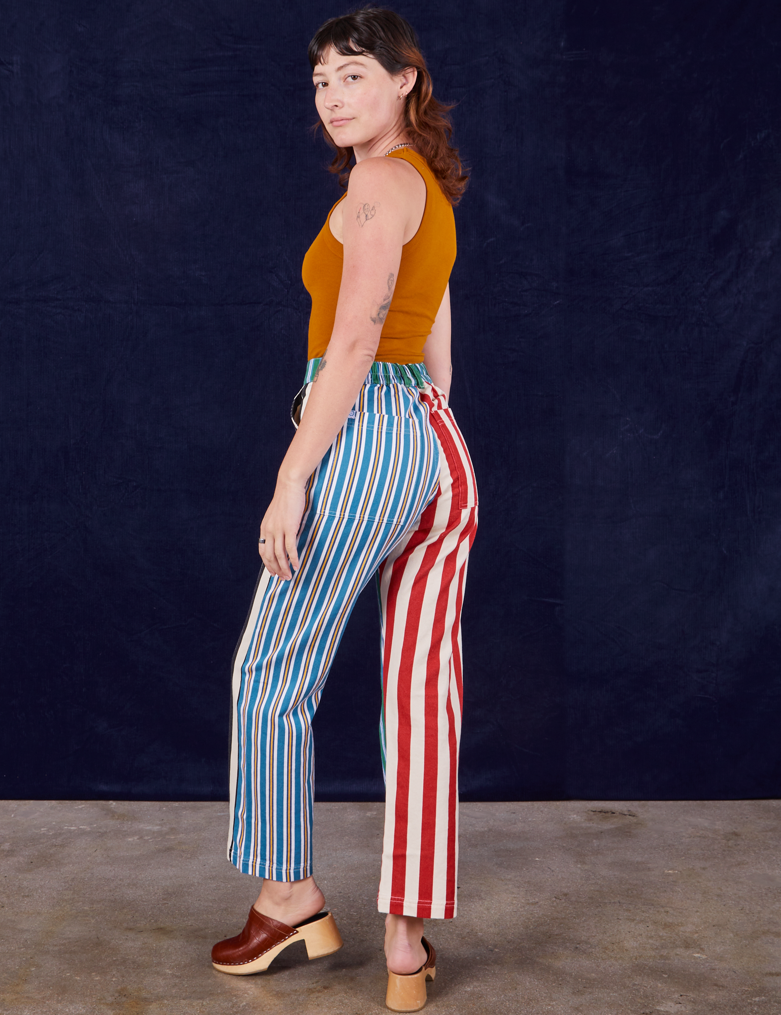 Angled back view of 4-Way Stripe Work Pants on Alex