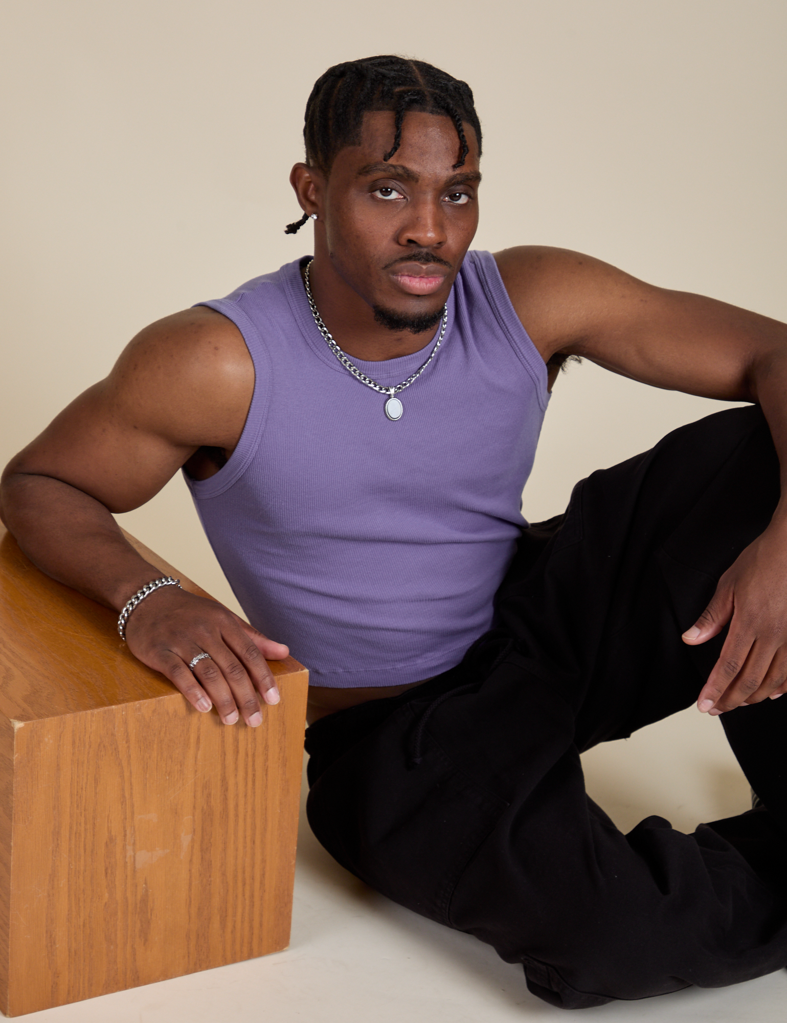 Isaac is wearing Muscle Tee in Faded Grape