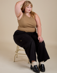 Juliet is wearing Muscle Tee in Desert Brown and black Drop Pocket Cargo Pants