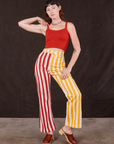 Alex is 5'8" and wearing XS Western Pants in Ketchup/Mustard Stripes paired with mustang red Cami
