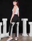 Angled back view of Column Work Pants in Basic Black and vintage off-white Cropped Tank Top