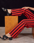 Black Stripe Work Pants in Mustang Red pant leg close up on Tiara