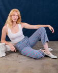 Margaret is wearing Stripe Work Pants in Blue Raspberry and Cropped Tank in vintage tee off-white