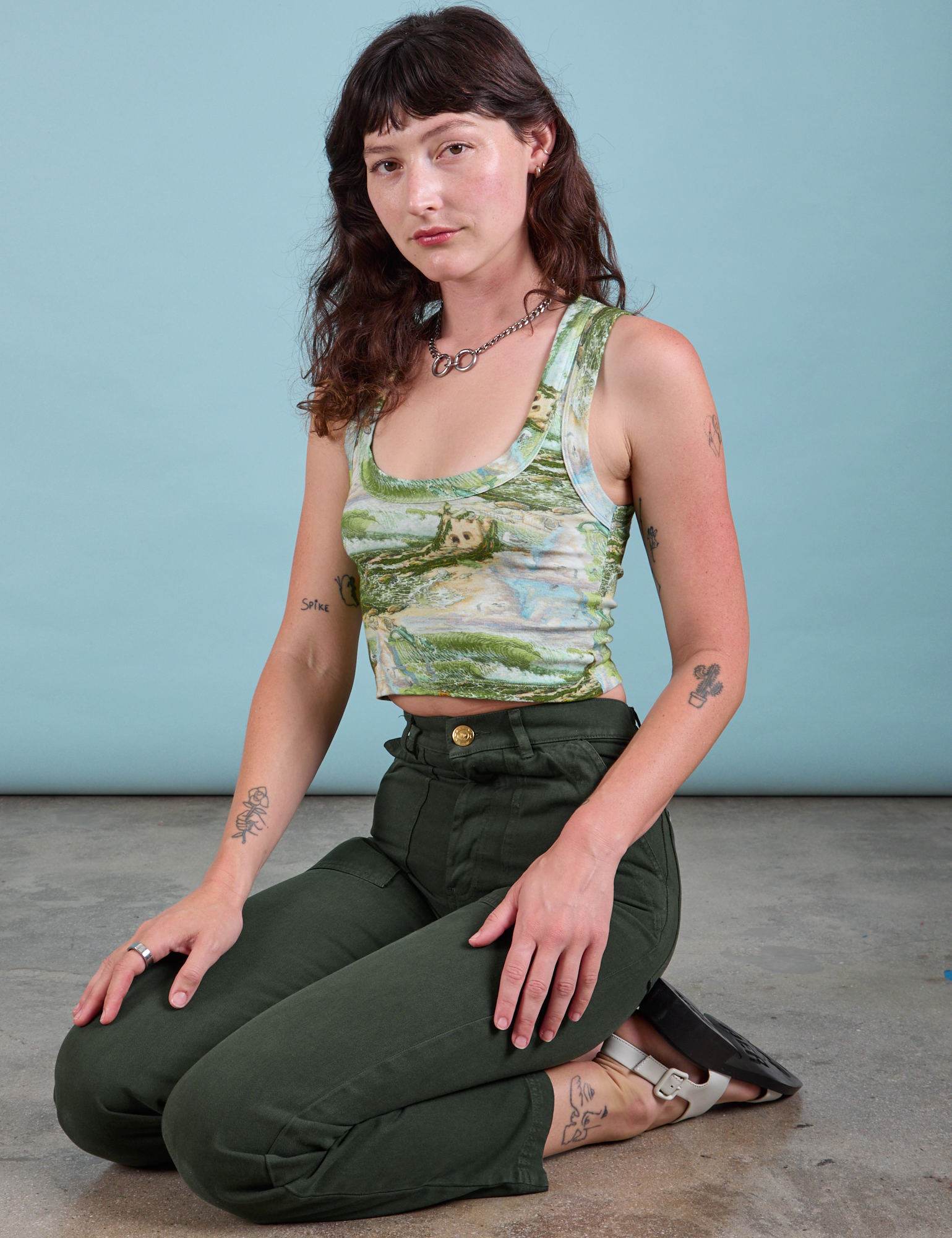 Cropped Tank Top in Ocean and Sky and swamp green Work Pants worn by Alex