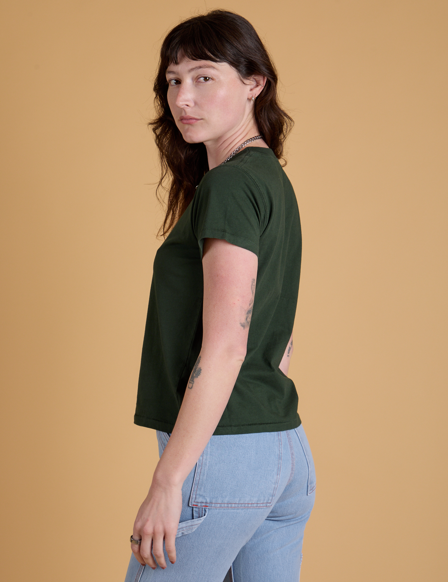 Side view of Organic Vintage Tee in Swamp Green on Alex