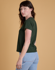 Side view of Organic Vintage Tee in Swamp Green on Alex