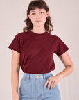 Alex is wearing Organic Vintage Tee in Red Wine tucked into her light wash Carpenter Jeans