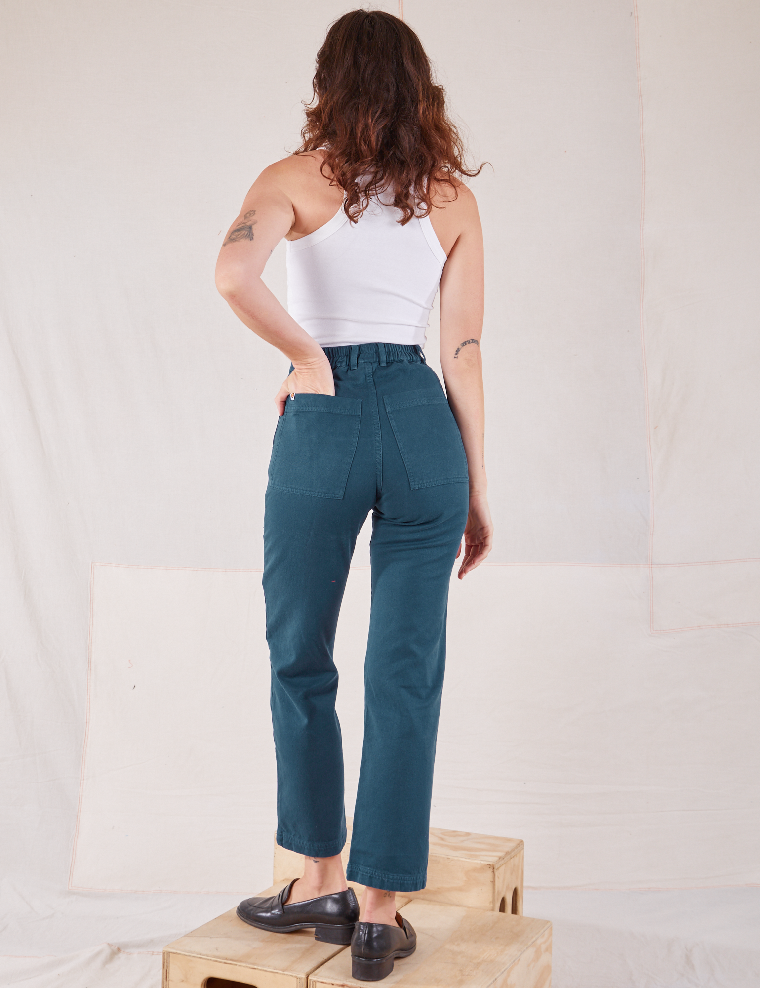 Organic Work Pants in Lagoon back view on Alex