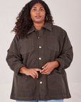 Morgan is wearing a buttoned up Field Coat in Espresso Brown