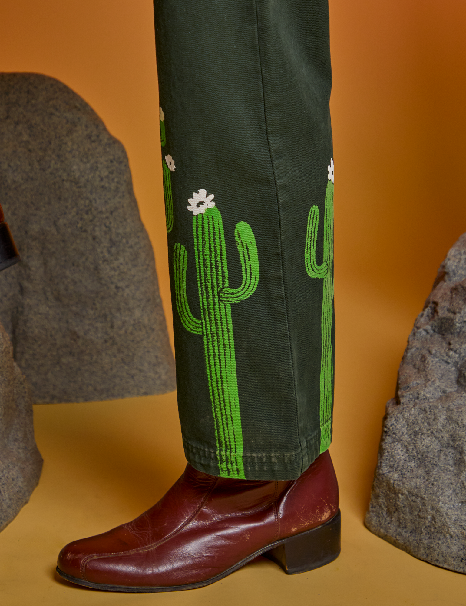 Paintstamped Work Pants in Cactus side view pant leg close up on Jesse