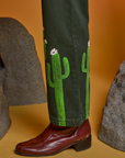 Paintstamped Work Pants in Cactus side view pant leg close up on Jesse