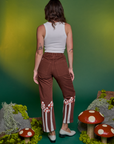 Back view of Paintstamped Work Pants in Mushroom and Cropped Tank in Vintage Tee White on Alex
