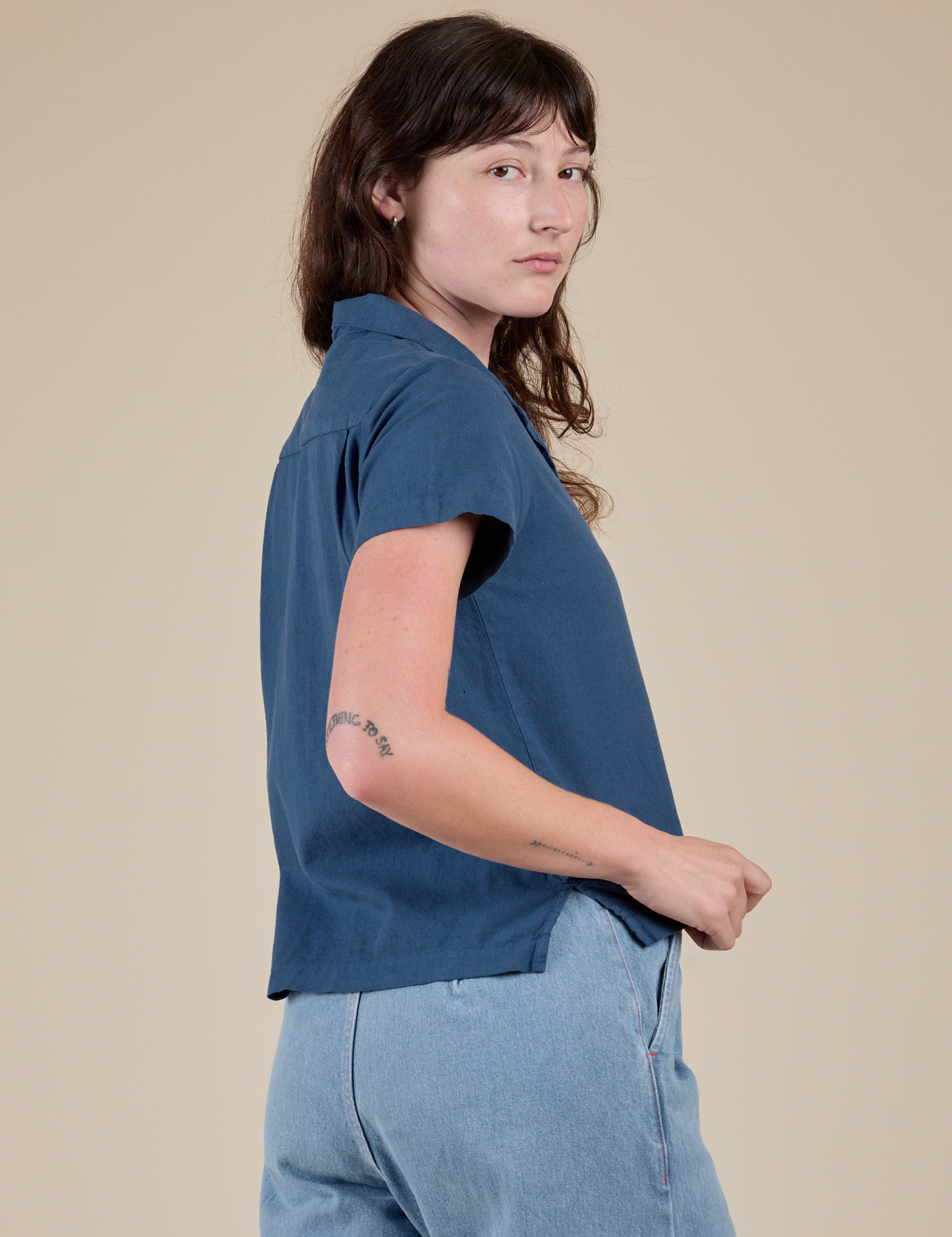 Angled back view of Pantry Button-Up in French Blue on Alex