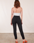 Back view of Pencil Pants in Basic Black and vintage off-white Halter Top on Alex