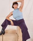 Tiara is wearing Sleeveless Essential Turtleneck in Periwinkle and nebula purple Bell Bottoms