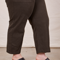 Pant leg side view of Petite Short Sleeve Jumpsuit in Espresso Brown worn by Ashley