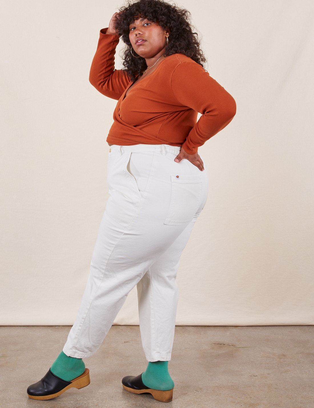 Work Pants in Vintage Off-White side view on Morgan wearing a burnt terracotta Wrap Top