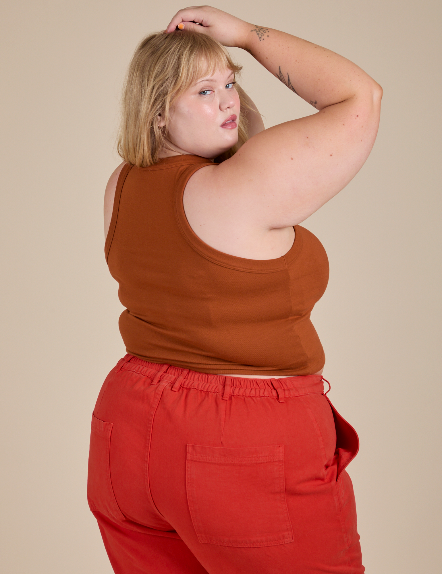 Racerback Tank in Burnt Terracotta angled back view on Juliet